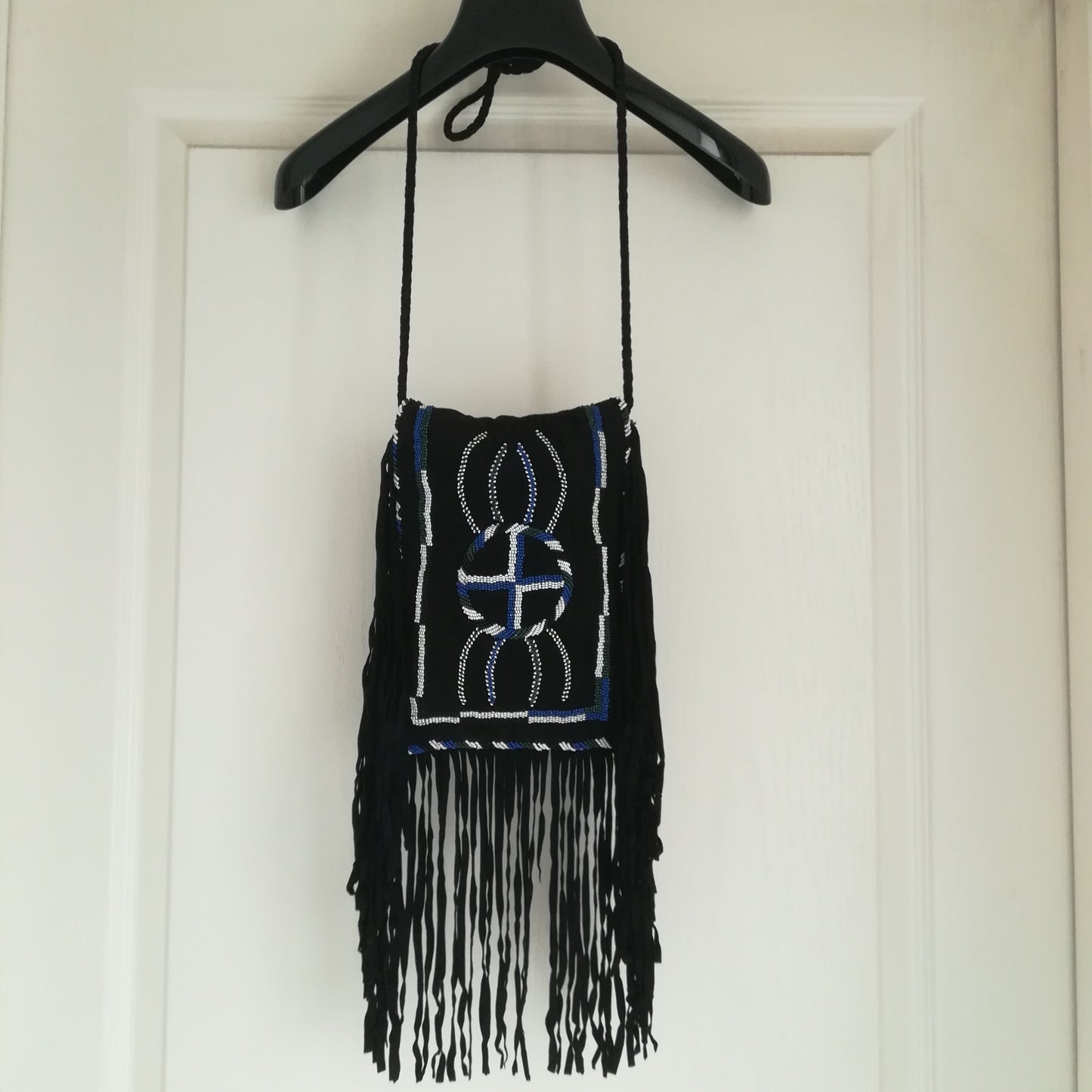 Black suede bag embroidered with pearls