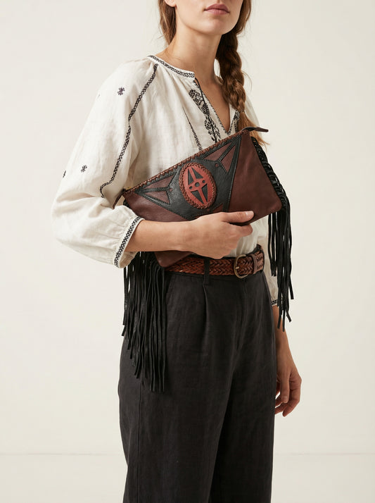 Brown and black leather clutch